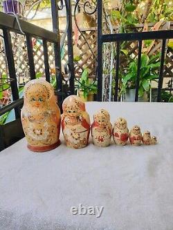 7 piece Russian Hand Painted Wood Burnt Nesting Dolls Artist Signed
