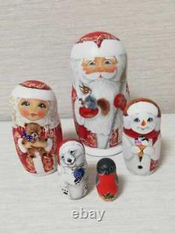Author's russian matryoshka Santa Claus in red with friends