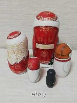 Author's russian matryoshka Santa Claus in red with friends