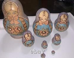 R. Cepzueb Nocag signed 8 pc Matryoshka nesting dolls Russian Signed Posad