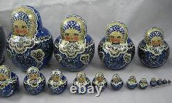 Russian Matryoshka blue and gold stacking dolls signed nest of 19 dolls 20 cm