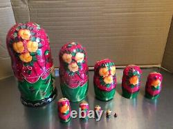 Russian nesting dolls hand painted with gold leaf, signed by artist